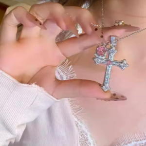 Sparkling Crystal Cross Pendant – Features a dazzling rhinestone crystal cross charm that catches light beautifully from every angle ✝️ Y2K Retro Inspired Design – Styled with a bold Y2K aesthetic necklace look, bringing back the iconic 2000s fashion trend in a modern way ⛓️ Edgy Punk Style Chain – Designed with a punk chain necklace finish that adds an edgy, street-style vibe to any outfit 🌸 Sweet & Feminine Touch – Perfectly balances cute girly jewelry with a bold cross pendant, ideal for teen girls and young women 🎉 Party & Event Ready – A stunning party fashion necklace that shines under lights, perfect for nights out, concerts, and celebrations 👗 Versatile Fashion Accessory – Pairs effortlessly with trendy women's fashion accessories, from crop tops to dresses and streetwear looks 🪨 Lightweight Crystal Material – Made with high-quality crystal embellished jewelry that is lightweight, comfortable, and long-lasting