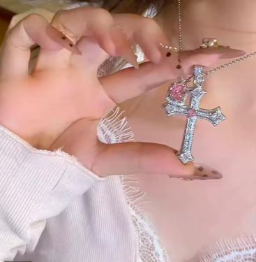 Sparkling Crystal Cross Pendant – Features a dazzling rhinestone crystal cross charm that catches light beautifully from every angle ✝️ Y2K Retro Inspired Design – Styled with a bold Y2K aesthetic necklace look, bringing back the iconic 2000s fashion trend in a modern way ⛓️ Edgy Punk Style Chain – Designed with a punk chain necklace finish that adds an edgy, street-style vibe to any outfit 🌸 Sweet & Feminine Touch – Perfectly balances cute girly jewelry with a bold cross pendant, ideal for teen girls and young women 🎉 Party & Event Ready – A stunning party fashion necklace that shines under lights, perfect for nights out, concerts, and celebrations 👗 Versatile Fashion Accessory – Pairs effortlessly with trendy women's fashion accessories, from crop tops to dresses and streetwear looks 🪨 Lightweight Crystal Material – Made with high-quality crystal embellished jewelry that is lightweight, comfortable, and long-lasting